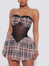 Plaid dress with a black bodice on a white background