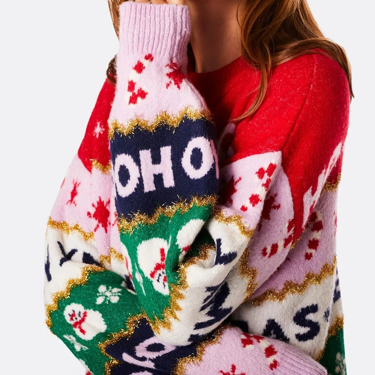 Colorful sweater with 'HO HIO' text held by a person