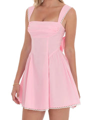 Pink dress with lace trim on a white background