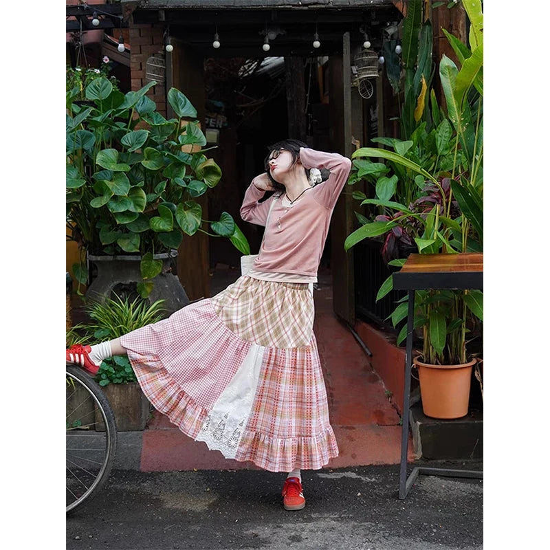 Women's plaid patchwork midi skirt with lace decoration and A-line silhouette.