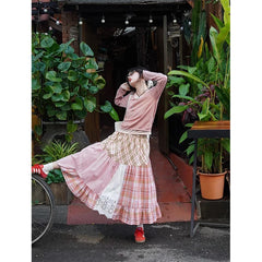 Women's plaid patchwork midi skirt with lace decoration and A-line silhouette.