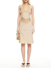 Woman wearing a beige dress with lace details