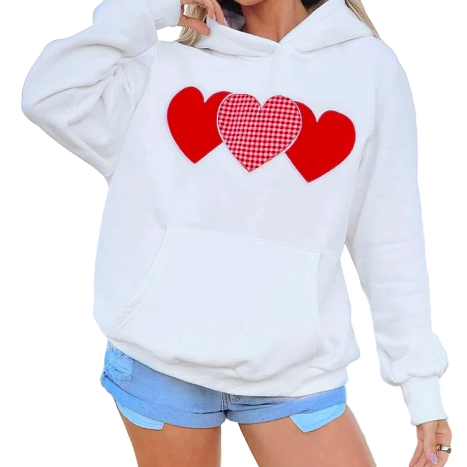 White hoodie with red heart designs worn by a person