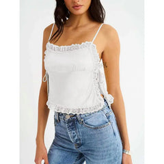 Model displaying a short lace trim satin cami top with an open back.