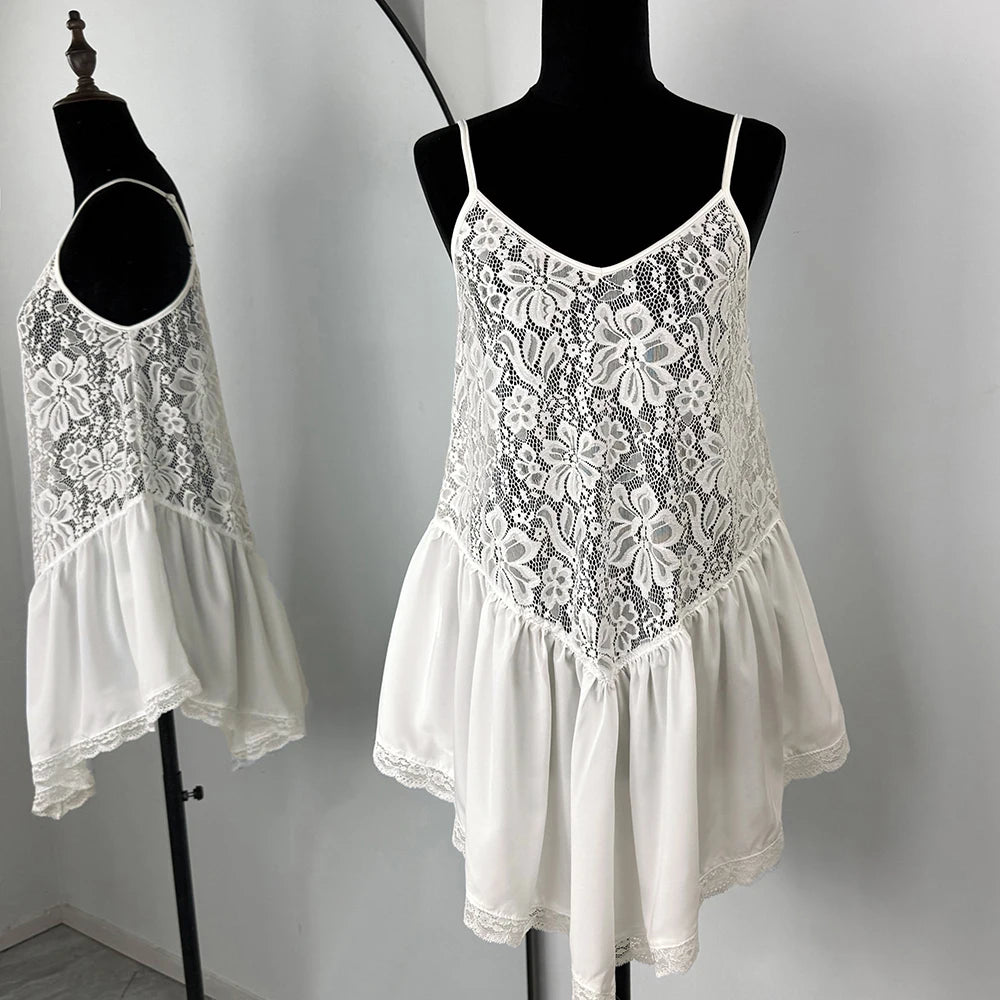 White lace dress on a mannequin against a plain background