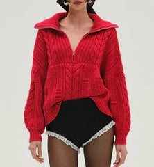 Person wearing a red knitted sweater with a white background