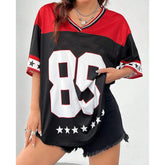 Person wearing a black and red sports jersey with the number 88 on a plain background
