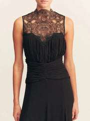 Black sleeveless top with lace detailing on a plain background