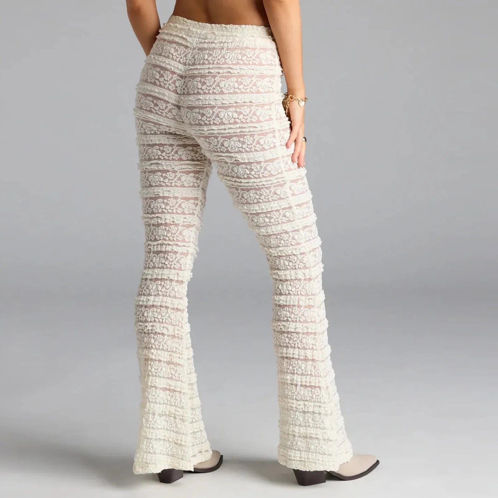 Person wearing textured white pants - back view