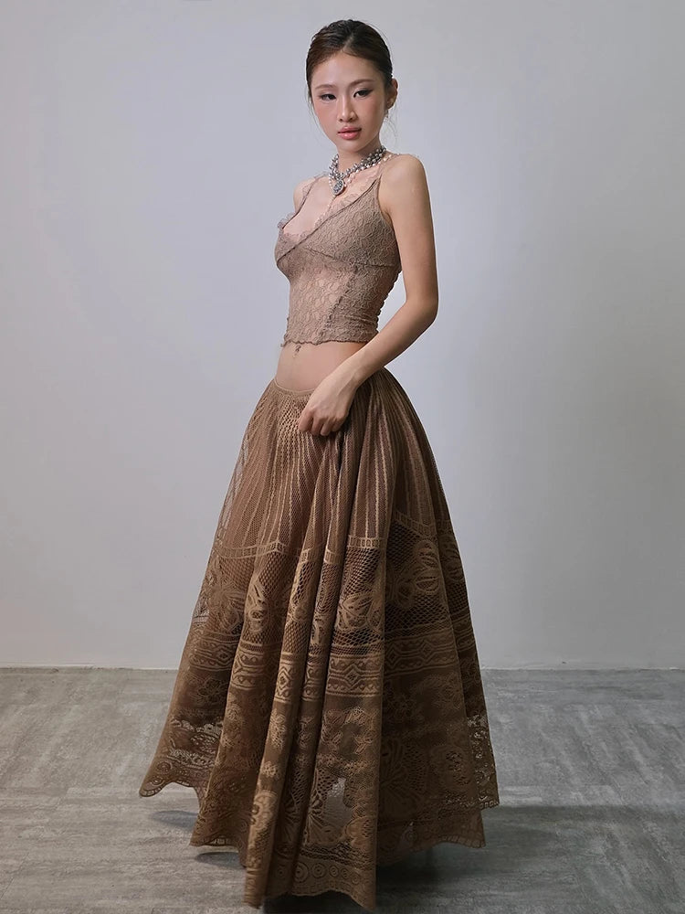 Woman wearing a brown evening gown with a plain background