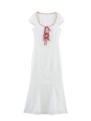 White dress with red accents
