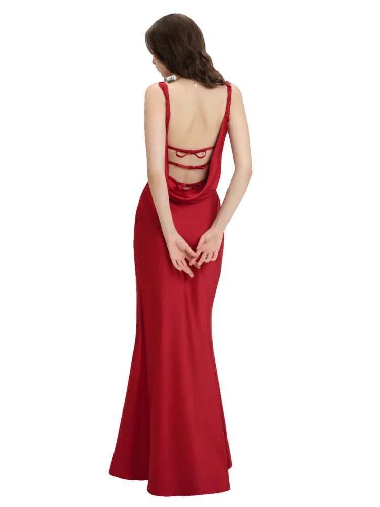 Red evening gown with cut-out back design on a white background