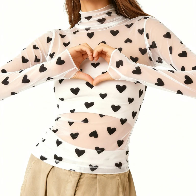 Sheer top with black heart patterns