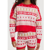 Red and white patterned sweater and shorts set on a plain background