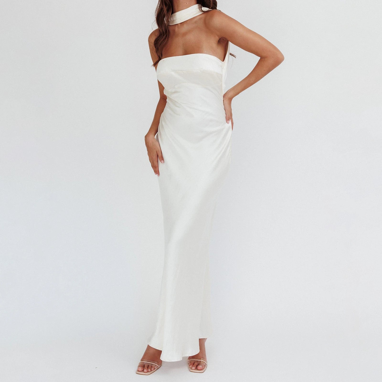 Woman wearing a strapless white dress- side