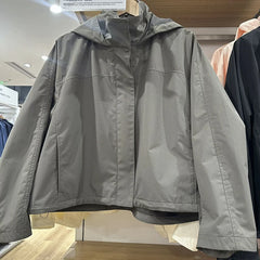 Gray jacket on a mannequin in a store setting