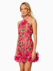 Woman wearing a pink floral dress on a white background