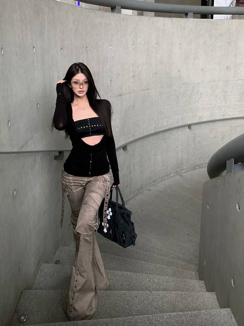 Women's black long sleeve cut out drape halter top with asymmetrical collar.