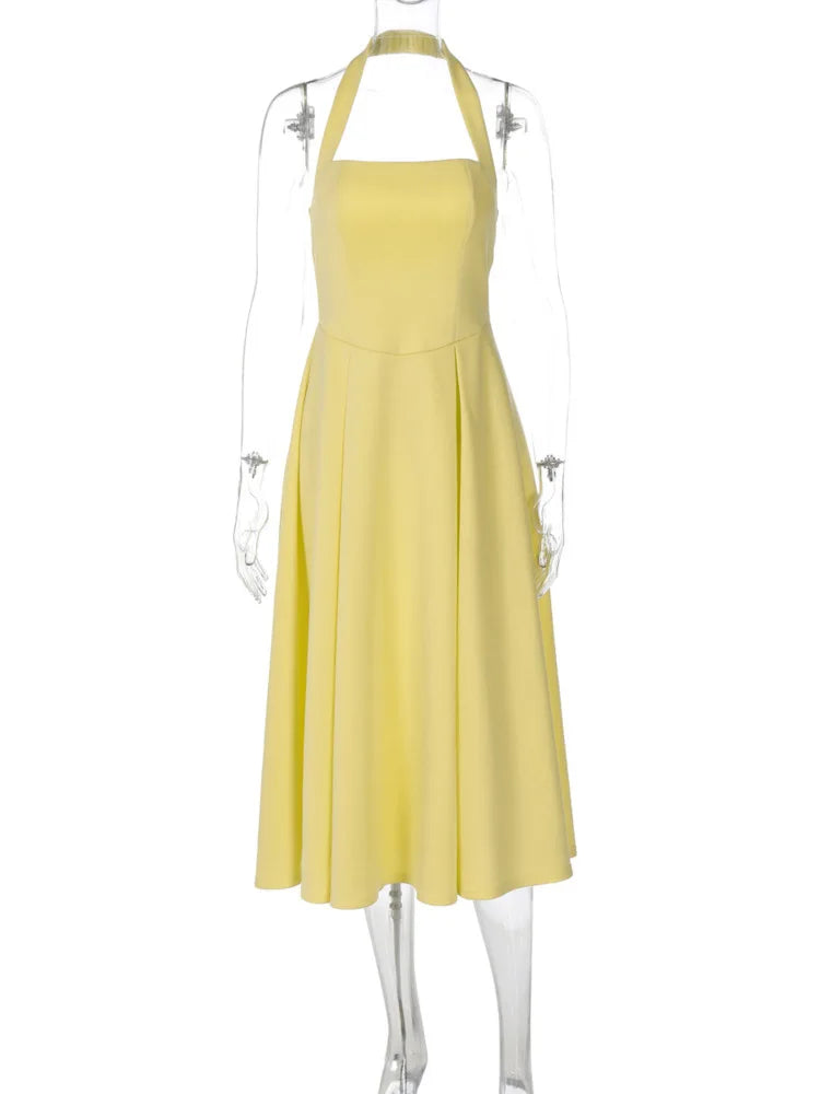 Yellow dress on a mannequin against a white background