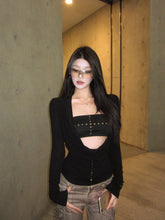 Women's black long sleeve cut out drape halter top with asymmetrical collar.