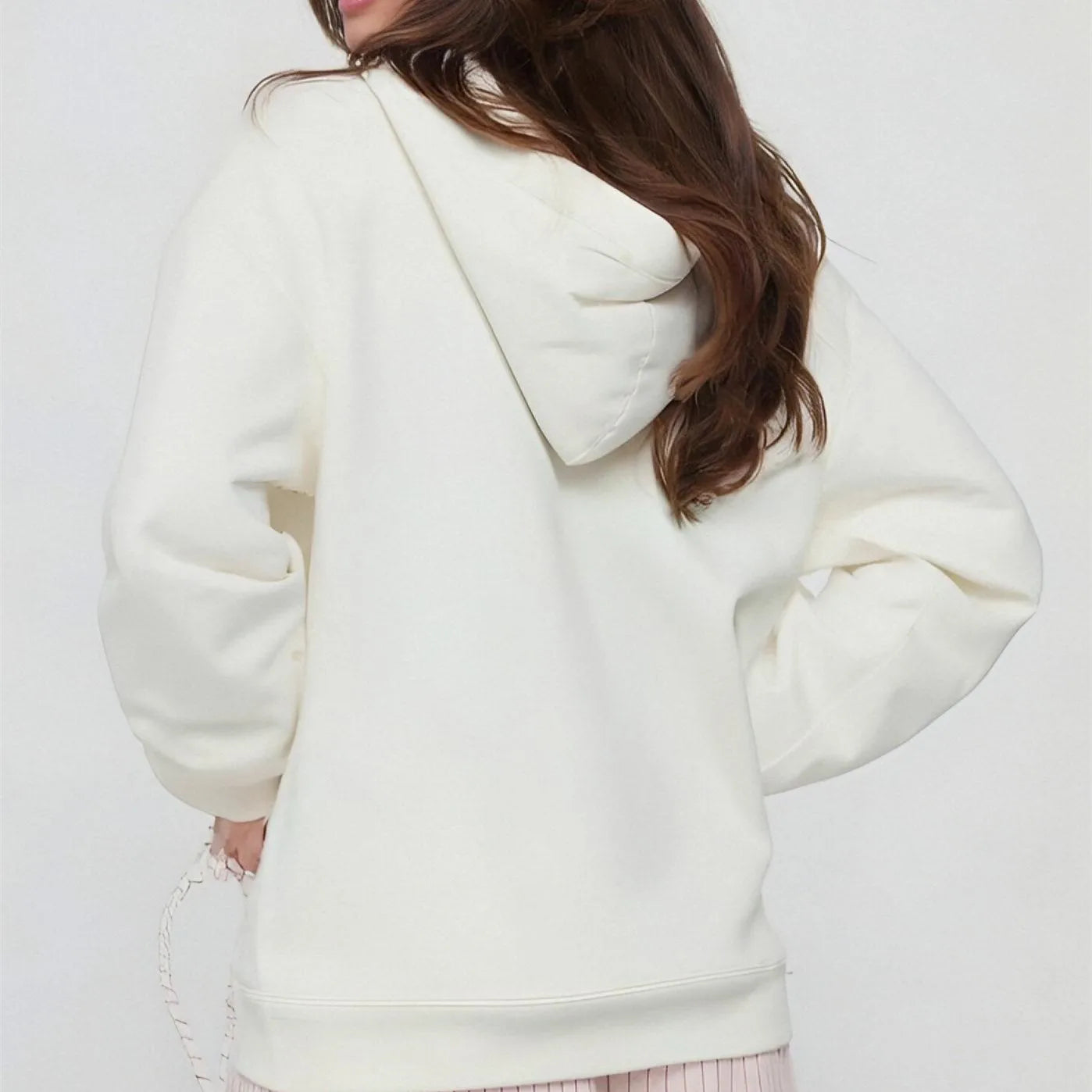 Person wearing a white hoodie