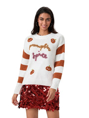 Woman wearing a white sweater with brown stripes and pumpkin spice text, paired with a red sequin skirt on a white background.