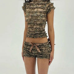 Camouflage-patterned outfit with ruffled top and shorts