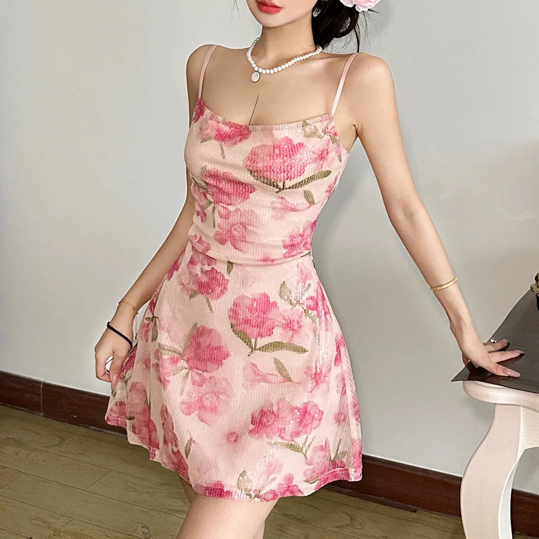 Woman wearing a pink floral dress