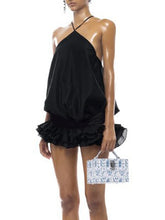Women's black halter open back mini dress with a vintage sheath style.