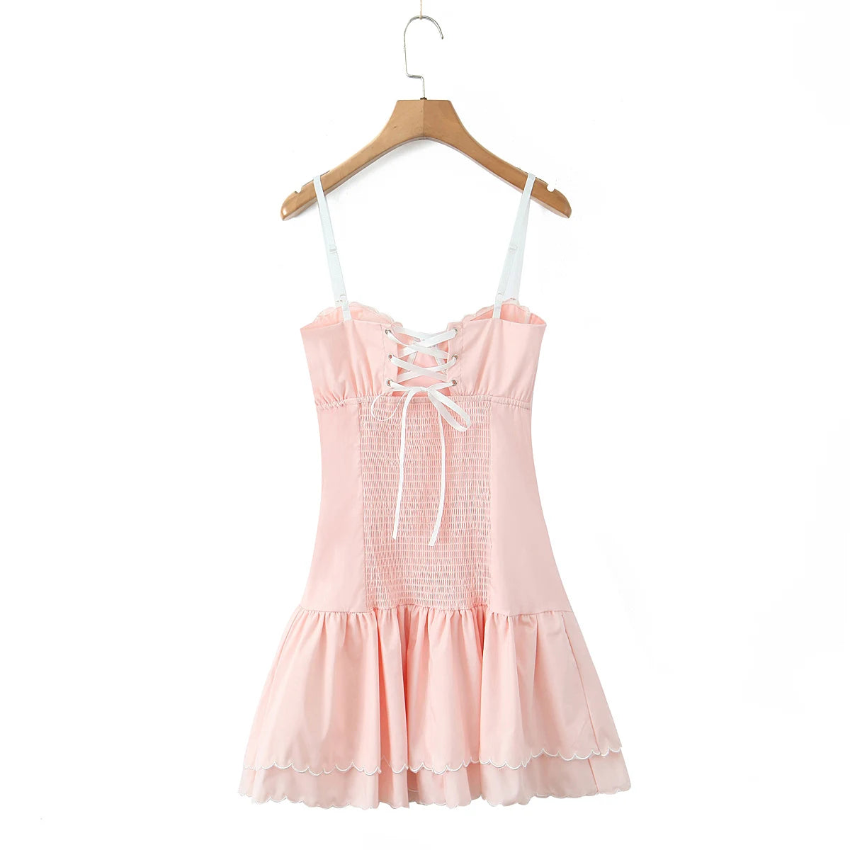 Pink dress with lace-up front on a wooden hanger - back lace details