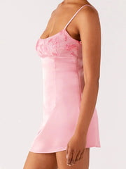 Pink slip dress worn by a person
