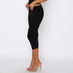 Black high-waist pants worn by a model, side view