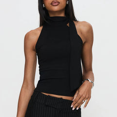 Model displaying a mock neck tie-up tank top in a solid color.