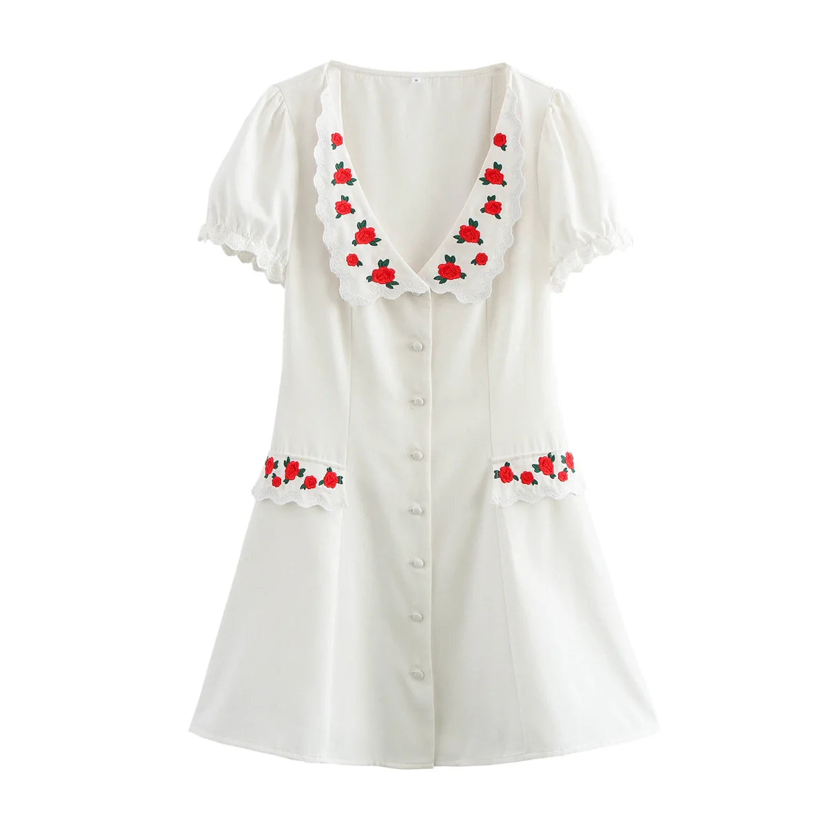 White blouse with red floral embroidery on a white background