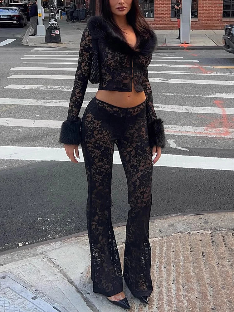 Person wearing black lace outfit with fur trim on a city street