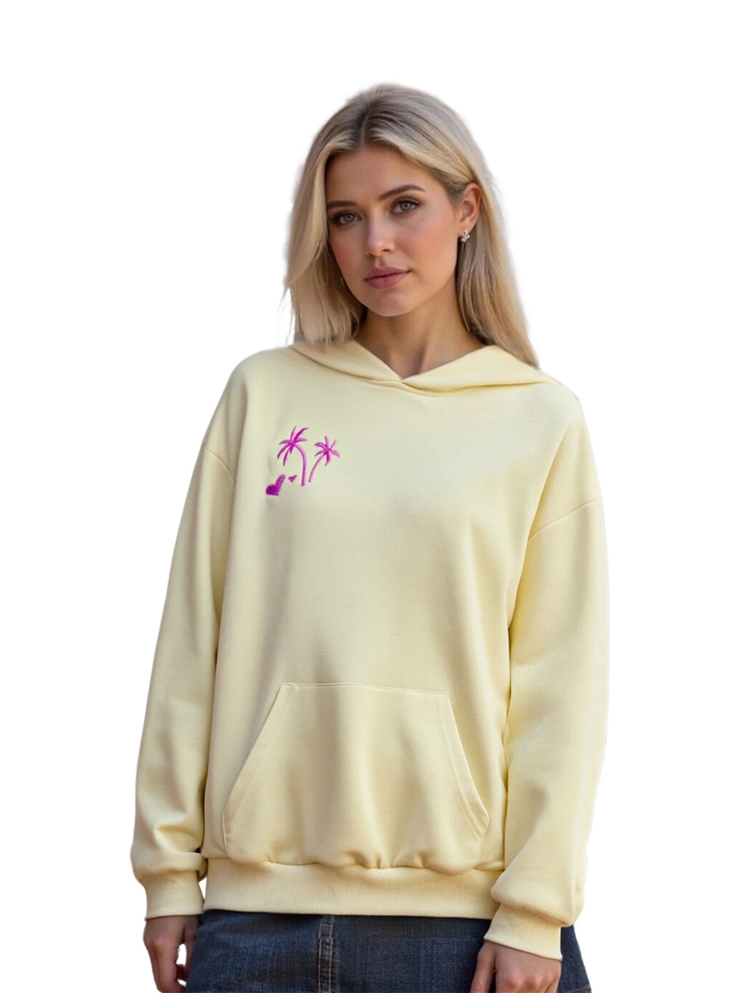 Woman wearing a light yellow hoodie with a pink graphic