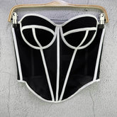 Black and white corset-style garment on a gray background