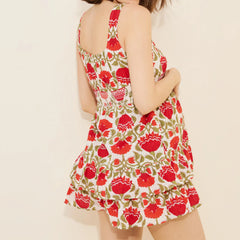 Woman wearing a floral dress with red flowers