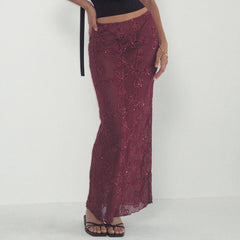 Maroon lace skirt worn by a person on a white background