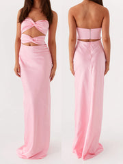 Pink strapless gown with cut-out design on a white background