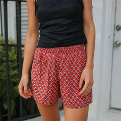 Women's red patterned shorts with an elastic waistband.