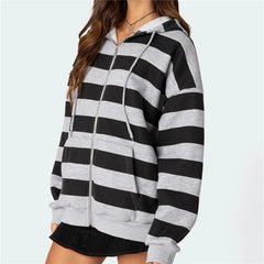 Black and gray striped hoodie worn by a person on a white background