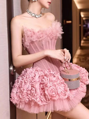Woman in a pink floral dress holding a matching handbag.