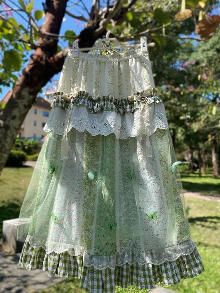 Women's green floral ruffle long skirt with A-line silhouette.