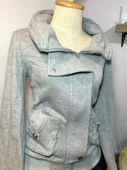 Light gray jacket on a mannequin against a white background
