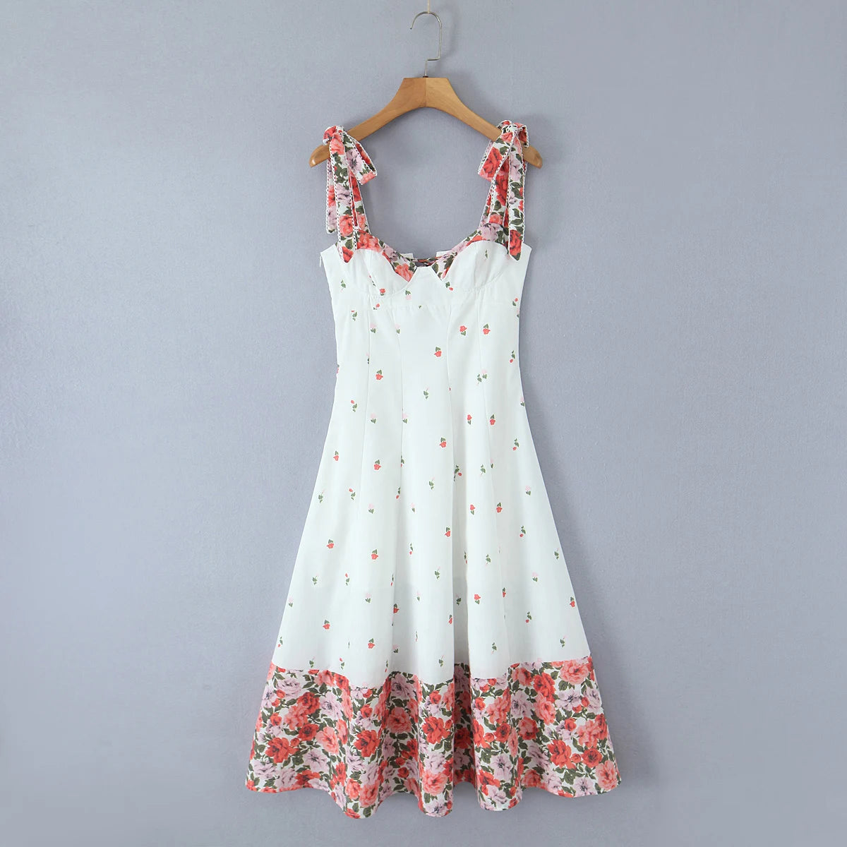 Women's white printed patchwork tie-up maxi dress with floral pattern and V-neck.