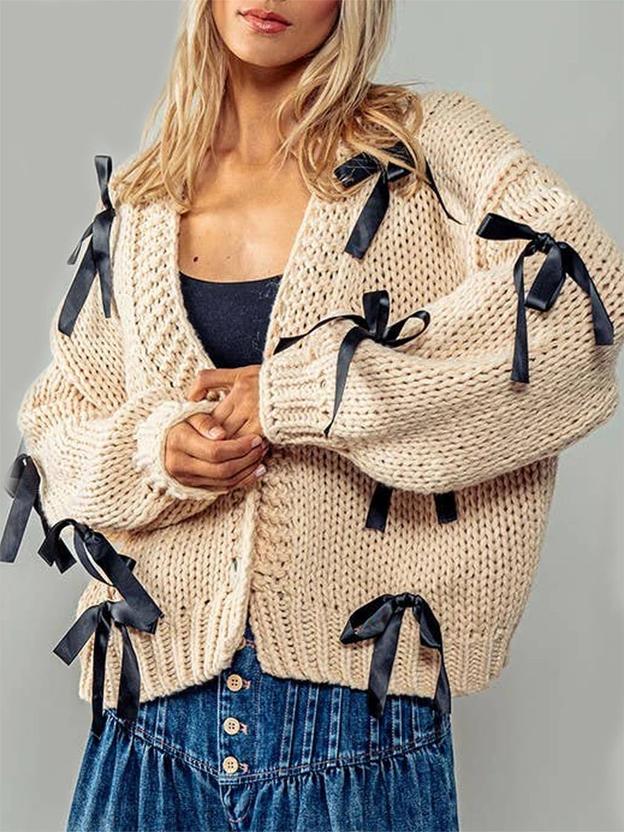 Beige knitted cardigan with black ribbons