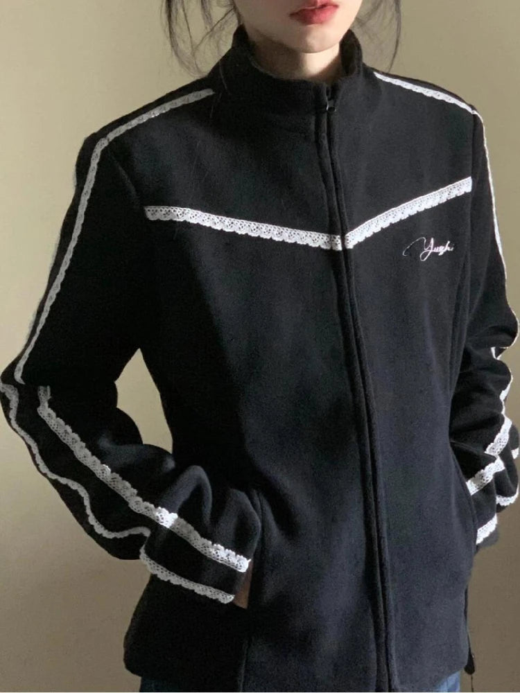 Black jacket with white accents and a logo on a plain background