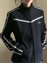 Black jacket with white accents and a logo on a plain background