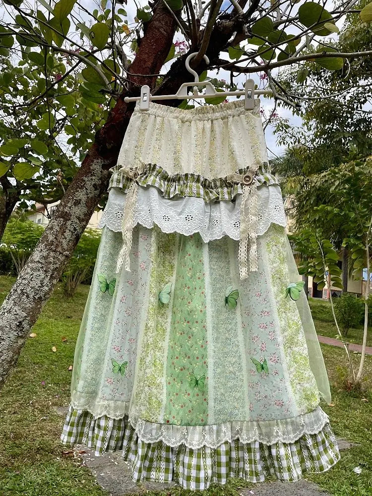 Women's green floral ruffle long skirt with A-line silhouette.